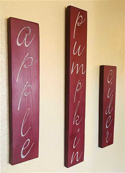 Creative Wood Sign with Fall words - Apple, Pumpkin, Cider. 3 Pieces with sawtooth hangers on back.
